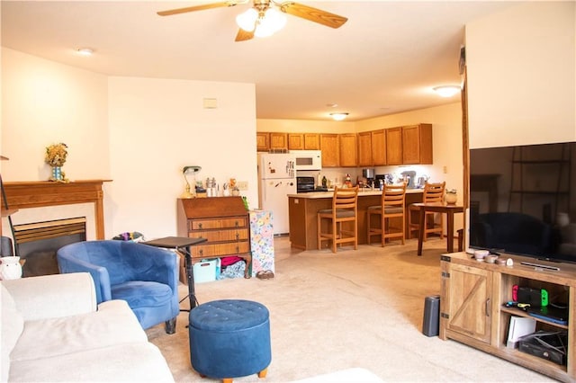 3215 Craig Rd Unit 3215, Eau Claire, WI 54701 - living room featuring light colored carpet, ceiling fan, and a fireplace