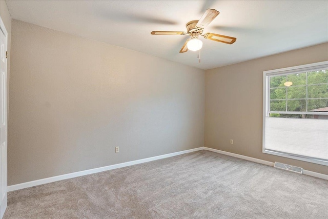 1125 W State St, Marshfield, WI 54449 - empty room featuring carpet floors and ceiling fan