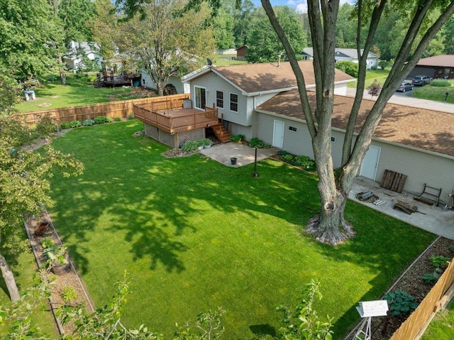 1125 W State St, Marshfield, WI 54449 - back of house featuring a deck, a patio area, a lawn, and a fire pit