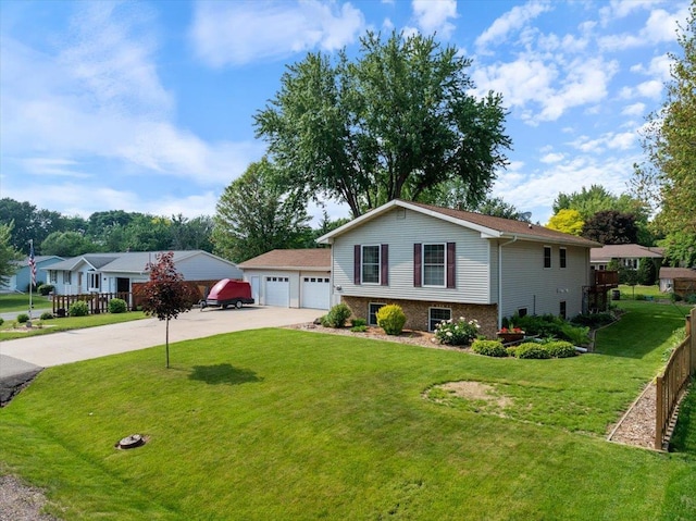1125 W State St, Marshfield, WI 54449 - tri-level home with a front yard, brick siding, and driveway