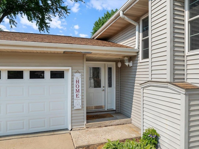 1125 W State St, Marshfield, WI 54449 - doorway to property featuring a garage and roof with shingles