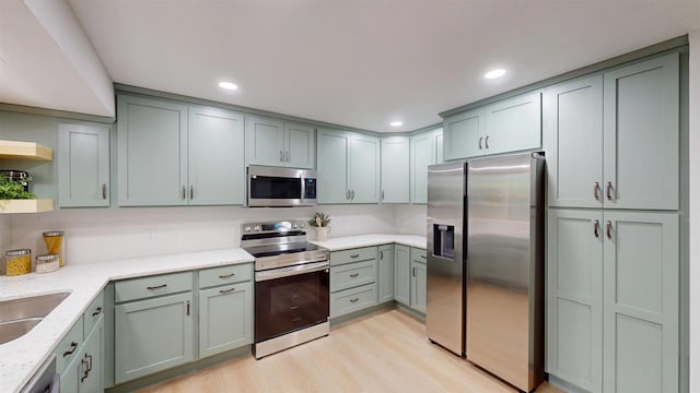 801 S Maryknoll Ave, Marshfield, WI 54449 - kitchen with stainless steel appliances, open shelves, light stone countertops, light wood-style floors, and recessed lighting