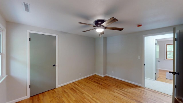 801 S Maryknoll Ave, Marshfield, WI 54449 - unfurnished bedroom with light wood-style floors and ceiling fan