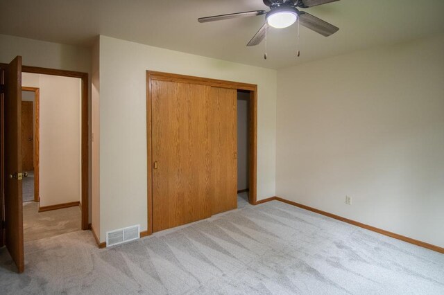 5947 Pilgrim Way, Mount Pleasant, WI 53406 - unfurnished bedroom with carpet flooring, a closet, and a ceiling fan