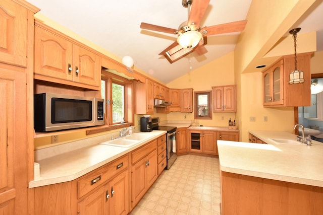 3786 S 35th St, Greenfield, WI 53221 - kitchen featuring appliances with stainless steel finishes, vaulted ceiling, under cabinet range hood, a ceiling fan, and light countertops