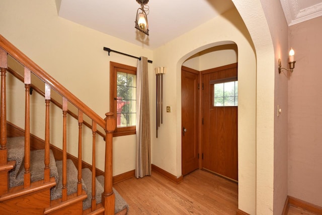 3786 S 35th St, Greenfield, WI 53221 - entryway with arched walkways, wood finished floors, and stairway