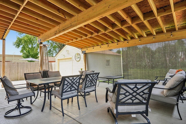 323 S 79th St, Milwaukee, WI 53214 - view of patio / terrace with outdoor dining area and an outbuilding