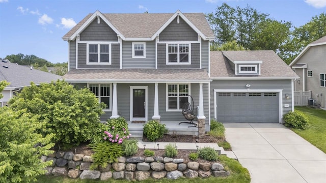 405 Blue Moon Dr, Verona, WI 53593 - craftsman-style house with a porch, a shingled roof, a garage, and driveway