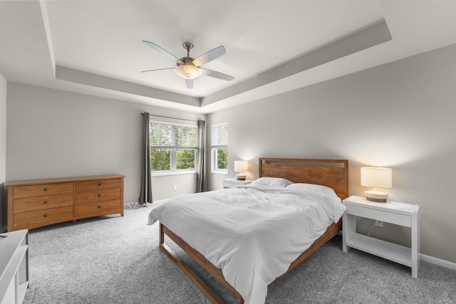 405 Blue Moon Dr, Verona, WI 53593 - bedroom featuring a tray ceiling, carpet, and a ceiling fan