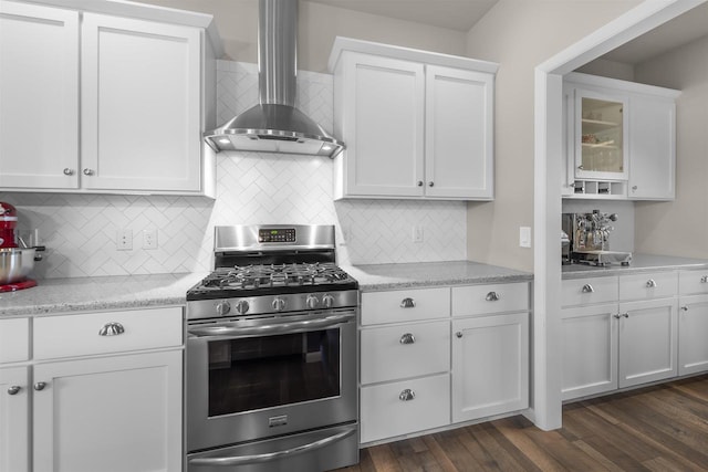 405 Blue Moon Dr, Verona, WI 53593 - kitchen with stainless steel gas range, wall chimney range hood, white cabinetry, and tasteful backsplash