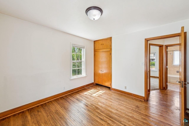 120 W 12th St, Ashland, WI 54806 - spare room featuring hardwood / wood-style flooring