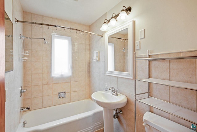 120 W 12th St, Ashland, WI 54806 - bathroom featuring tile walls and shower / bath combination