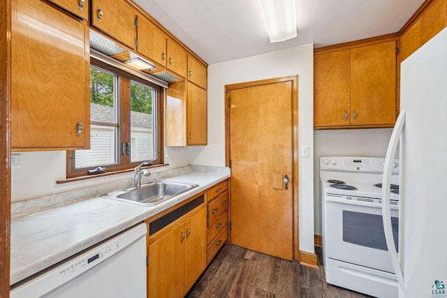120 W 12th St, Ashland, WI 54806 - kitchen featuring white appliances, dark wood finished floors, light countertops, and brown cabinets
