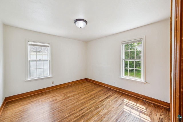 120 W 12th St, Ashland, WI 54806 - empty room featuring hardwood / wood-style floors and baseboards