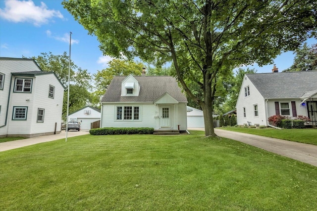 2874 S Conger Pl, West Allis, WI 53227 - cape cod house featuring a garage, an outdoor structure, entry steps, and a front lawn