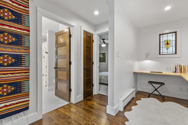 175 Old Wausau Rd, Stevens Point, WI 54481 - corridor featuring baseboard heating, wood finished floors, an office area, and recessed lighting