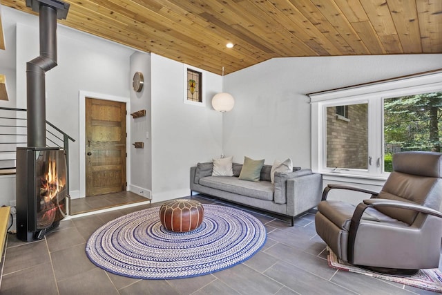 175 Old Wausau Rd, Stevens Point, WI 54481 - tiled living room featuring vaulted ceiling, a wood stove, wood ceiling, and recessed lighting