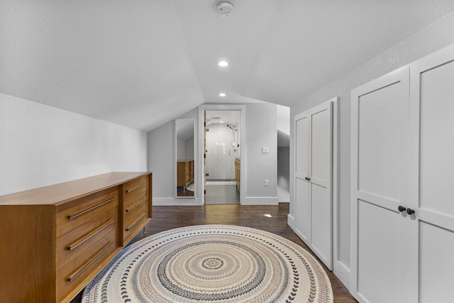 175 Old Wausau Rd, Stevens Point, WI 54481 - bedroom featuring vaulted ceiling, recessed lighting, dark wood-type flooring, and two closets