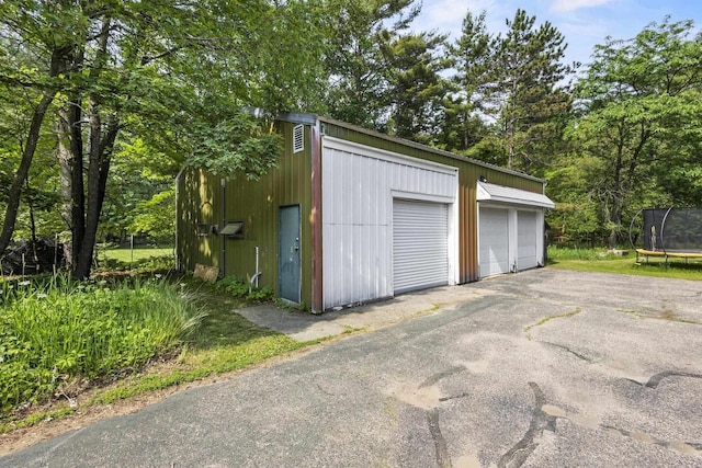 175 Old Wausau Rd, Stevens Point, WI 54481 - detached garage featuring a trampoline