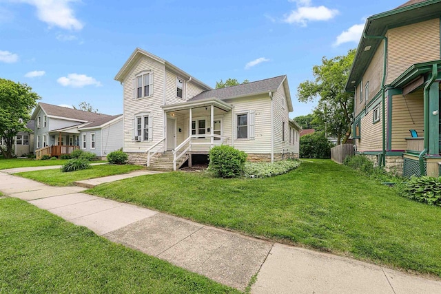 274 E 1st St, Fond Du Lac, WI 54935 - view of front of property with a porch and a front yard