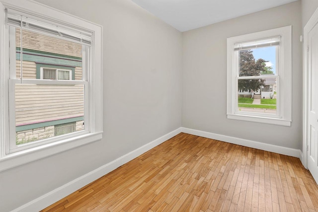 274 E 1st St, Fond Du Lac, WI 54935 - unfurnished room with baseboards and light wood-type flooring