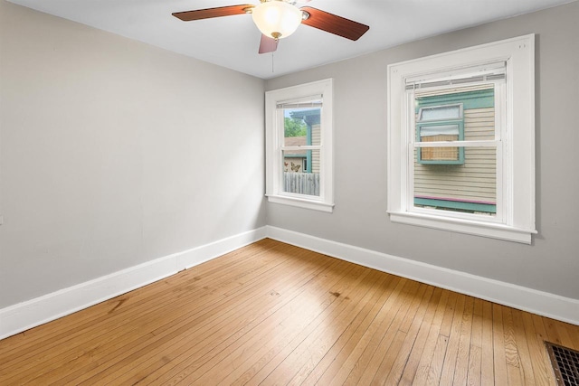 274 E 1st St, Fond Du Lac, WI 54935 - unfurnished room featuring hardwood / wood-style floors and a ceiling fan