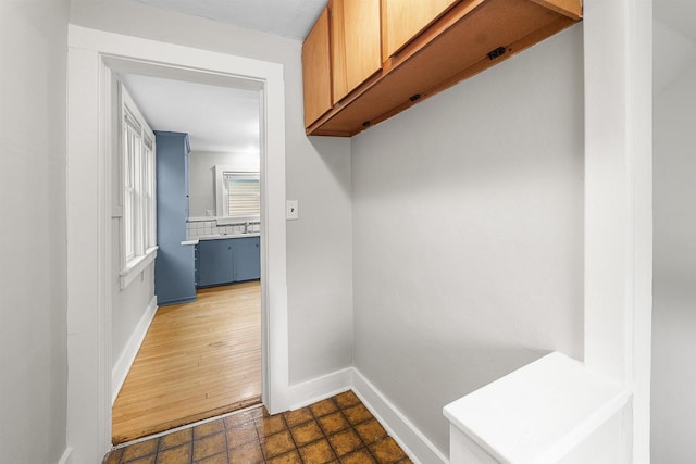 274 E 1st St, Fond Du Lac, WI 54935 - mudroom featuring baseboards and a sink