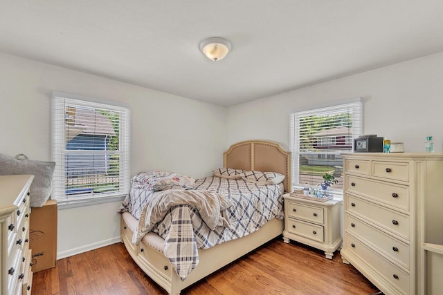 4951 N 49th St, Milwaukee, WI 53218 - bedroom featuring multiple windows and light wood-style flooring