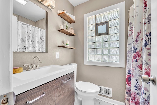 4951 N 49th St, Milwaukee, WI 53218 - full bathroom featuring healthy amount of natural light, vanity, tile patterned flooring, and curtained shower
