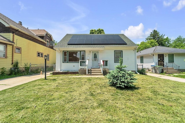 4951 N 49th St, Milwaukee, WI 53218 - bungalow-style house featuring roof mounted solar panels and roof with shingles