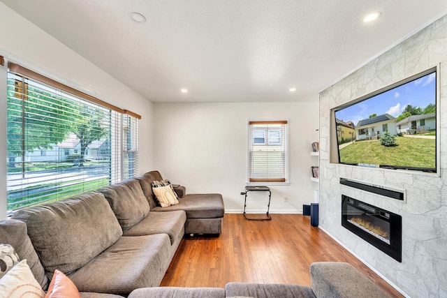4951 N 49th St, Milwaukee, WI 53218 - living area with a large fireplace, wood finished floors, and recessed lighting