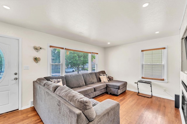 4951 N 49th St, Milwaukee, WI 53218 - living room with light wood-style floors and recessed lighting