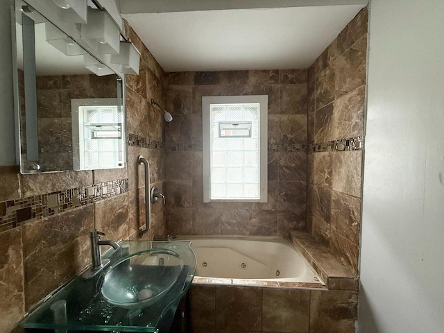 4668 N 29th St, Milwaukee, WI 53209 - full bathroom with plenty of natural light, tile walls, vanity, and a combined bath / shower with jetted tub