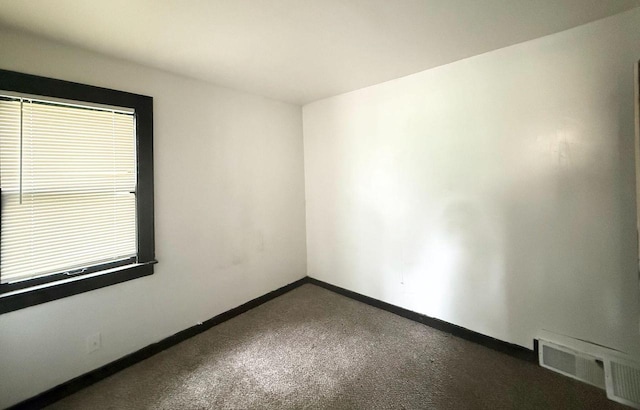 4668 N 29th St, Milwaukee, WI 53209 - empty room with baseboards and carpet flooring