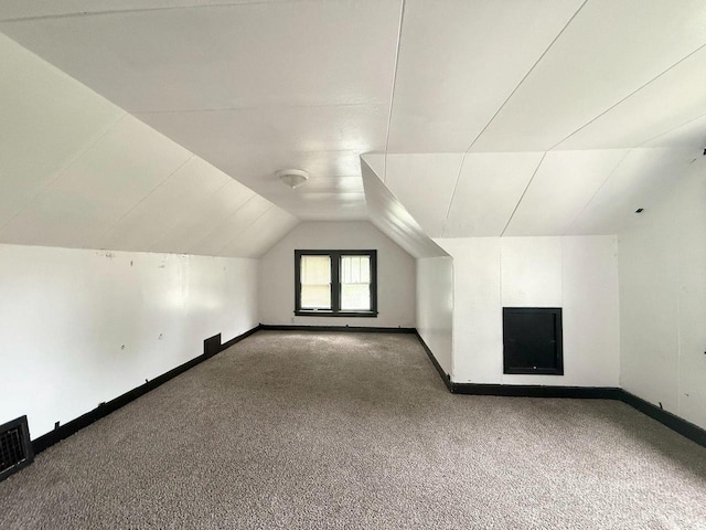4668 N 29th St, Milwaukee, WI 53209 - bonus room with carpet and lofted ceiling