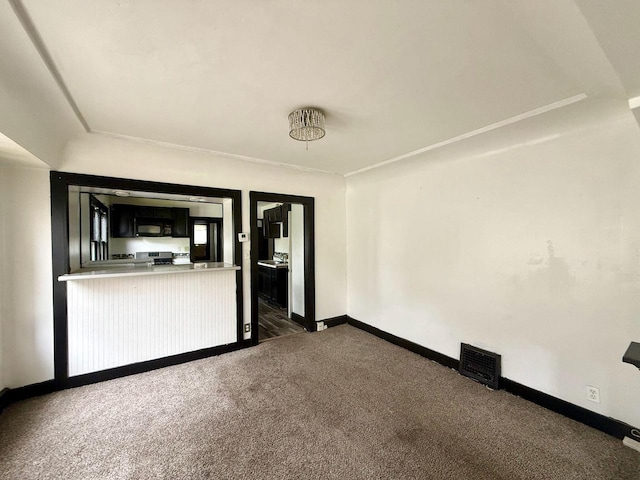 4668 N 29th St, Milwaukee, WI 53209 - unfurnished room featuring dark carpet and baseboards