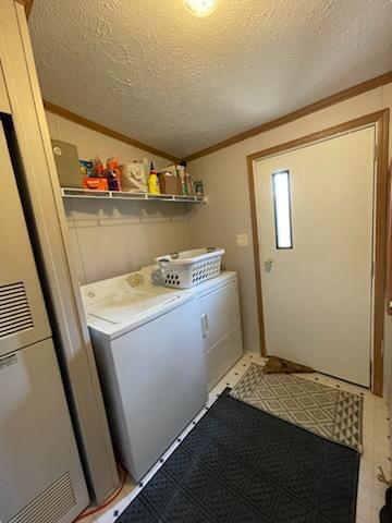 1116 Fawn Dr, Grand Marsh, WI 53936 - laundry room with crown molding, a heating unit, washer and dryer, a textured ceiling, and tile patterned floors