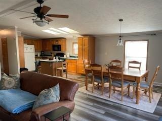 1116 Fawn Dr, Grand Marsh, WI 53936 - dining space featuring healthy amount of natural light, wood finished floors, and a ceiling fan