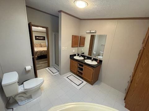 1116 Fawn Dr, Grand Marsh, WI 53936 - ensuite bathroom featuring crown molding, a textured ceiling, double vanity, and an enclosed shower