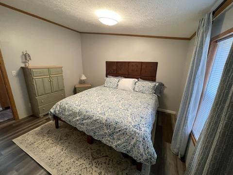 1116 Fawn Dr, Grand Marsh, WI 53936 - bedroom with wood finished floors, a textured ceiling, and ornamental molding