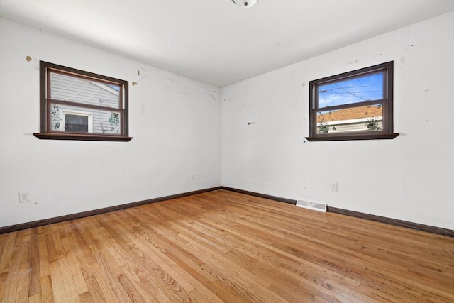 1708 Shoop St, Racine, WI 53404 - spare room featuring plenty of natural light and light wood-style flooring