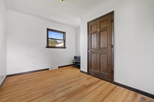 1708 Shoop St, Racine, WI 53404 - empty room with light wood-type flooring and baseboards