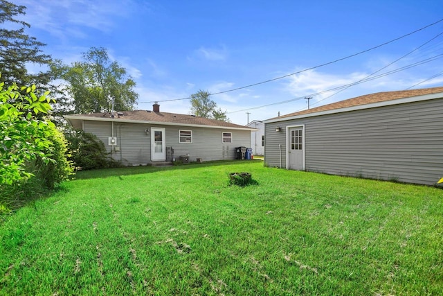 1708 Shoop St, Racine, WI 53404 - rear view of property featuring a lawn