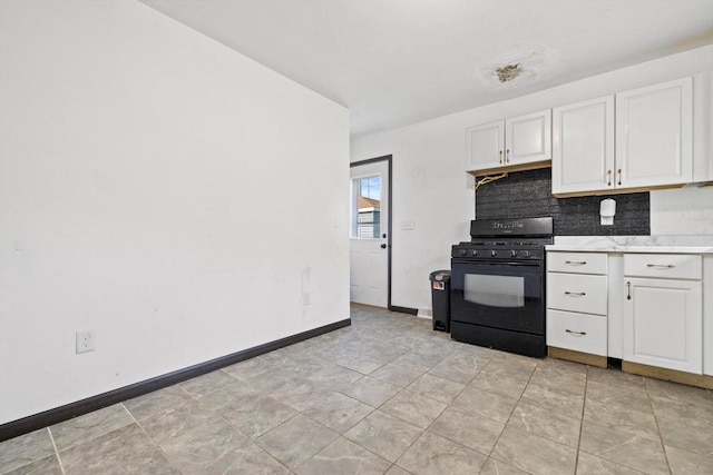 1708 Shoop St, Racine, WI 53404 - kitchen with black range with gas stovetop, white cabinets, light countertops, and backsplash