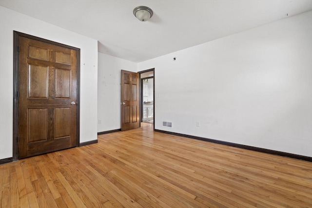1708 Shoop St, Racine, WI 53404 - unfurnished bedroom with light wood-style flooring and baseboards