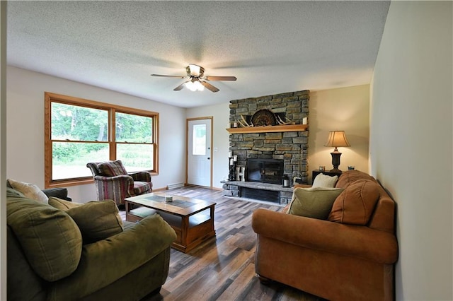 5342 W County Highway F, Trego, WI 54888 - living room with ceiling fan, wood finished floors, a textured ceiling, and a fireplace