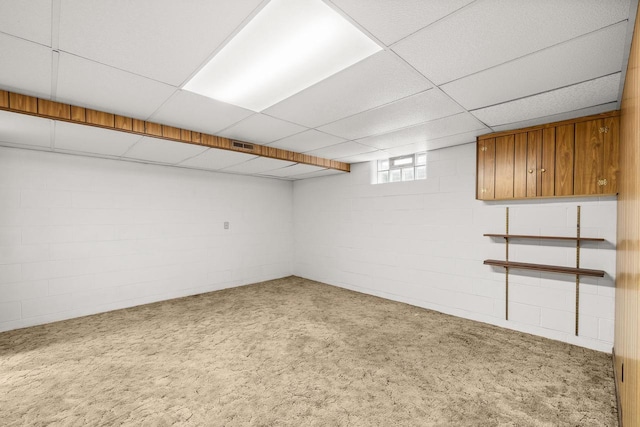 2908 Prais St, Stevens Point, WI 54481 - below grade area with carpet floors, a paneled ceiling, and concrete block wall