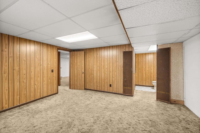 2908 Prais St, Stevens Point, WI 54481 - finished basement featuring carpet, a drop ceiling, and wooden walls