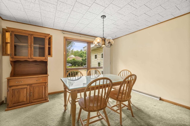2908 Prais St, Stevens Point, WI 54481 - dining area featuring light carpet, a chandelier, ornamental molding, and baseboard heating