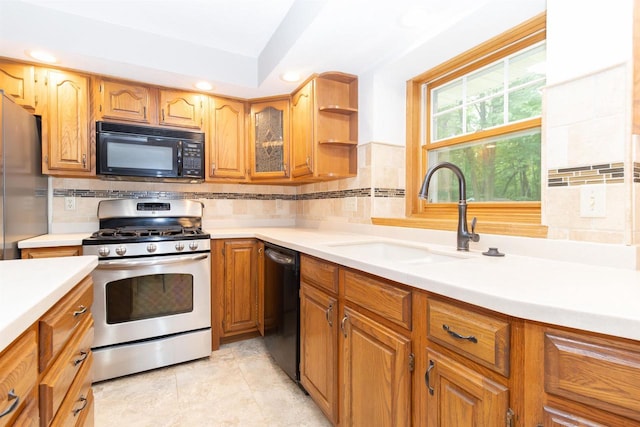 N2559 Pleasant View Ln, Waupaca, WI 54981 - kitchen featuring black appliances, light countertops, recessed lighting, decorative backsplash, and brown cabinets